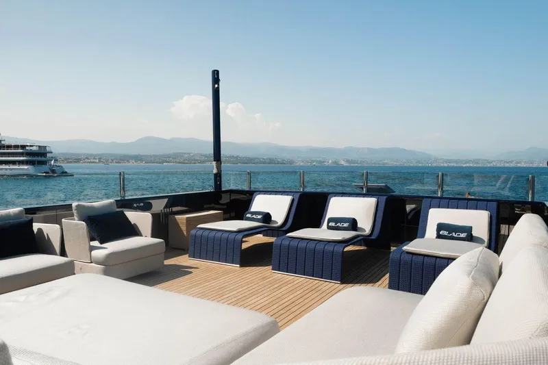 Blade II Yacht Photos Pics Luxurious yacht deck with lounge chairs, ocean view, MMGI BLADE II, 2009 model.