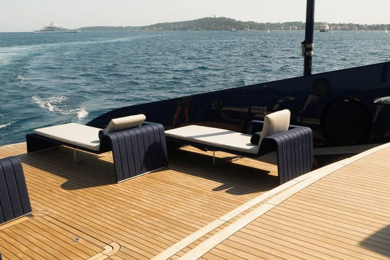 Blade II Yacht Photos Pics Luxury yacht deck with sun loungers, ocean view, MMGI BLADE II, 2009 model.