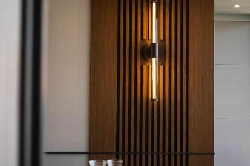 Blade II Yacht Photos Pics Modern wall light fixture on wooden slatted panel, MMGI BLADE II, 2009 design.