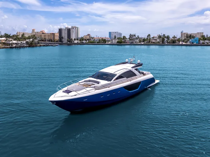 Bikinis Optional Yacht Photos Pics Luxury 2012 Cheoy Lee 76 Alpha yacht cruising in clear blue waters.