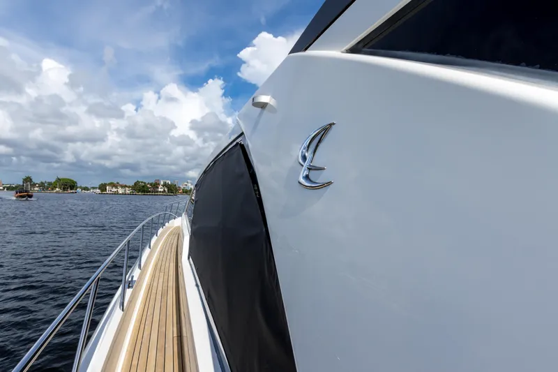 Bikinis Optional Yacht Photos Pics 2012 Cheoy Lee 76 Alpha yacht on water, showcasing sleek design and luxury features.