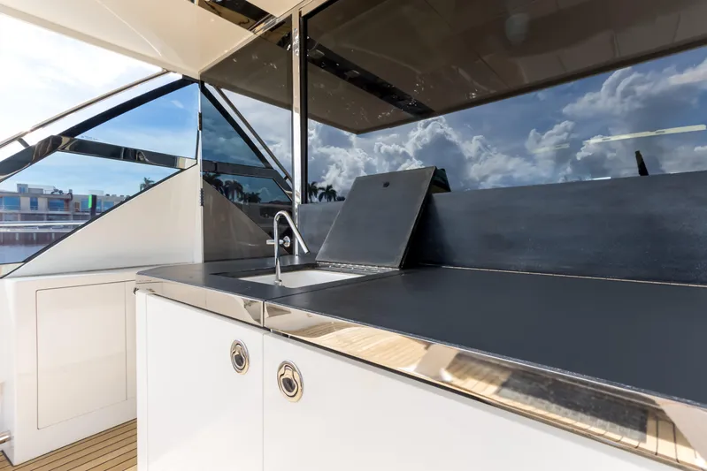 Bikinis Optional Yacht Photos Pics Outdoor kitchen on 2012 Cheoy Lee 76 Alpha yacht with sleek countertops and sink.