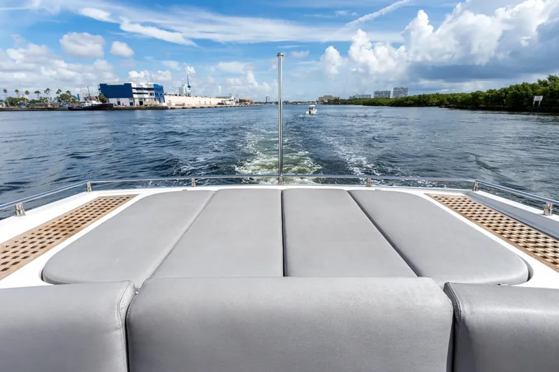 Bikinis Optional Yacht Photos Pics Cheoy Lee 76 Alpha yacht, 2012 model, cruising on a sunny day with scenic waterway views.