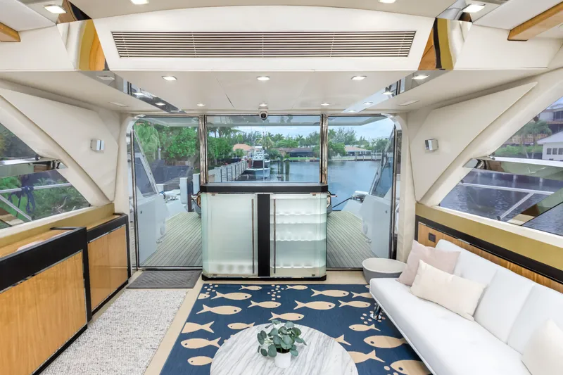 Bikinis Optional Yacht Photos Pics Luxurious interior of 2012 Cheoy Lee 76 Alpha yacht with modern decor and scenic view.