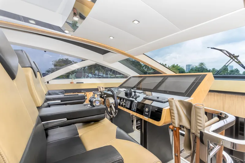 Bikinis Optional Yacht Photos Pics Luxurious interior of 2012 Cheoy Lee 76 Alpha yacht with modern helm and seating.