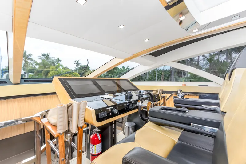 Bikinis Optional Yacht Photos Pics Luxurious 2012 Cheoy Lee 76 Alpha yacht helm with modern controls and plush seating.