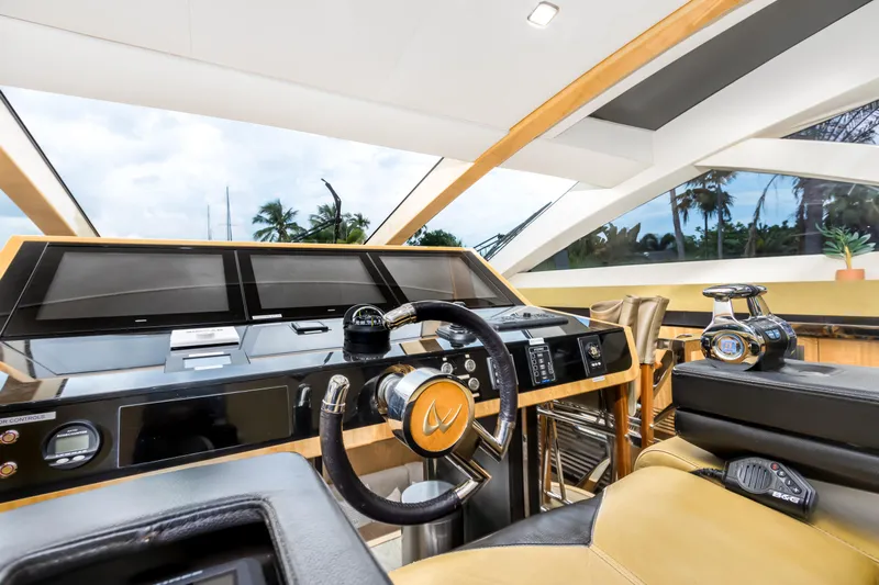 Bikinis Optional Yacht Photos Pics Luxurious helm of 2012 Cheoy Lee 76 Alpha yacht with modern controls and panoramic windows.