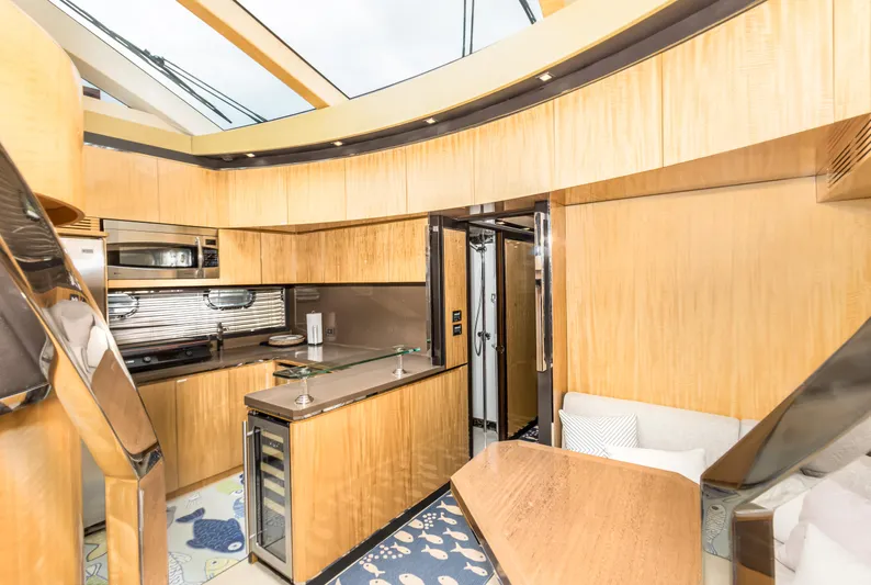 Bikinis Optional Yacht Photos Pics Luxurious interior of 2012 Cheoy Lee 76 Alpha yacht with modern kitchen and seating area.