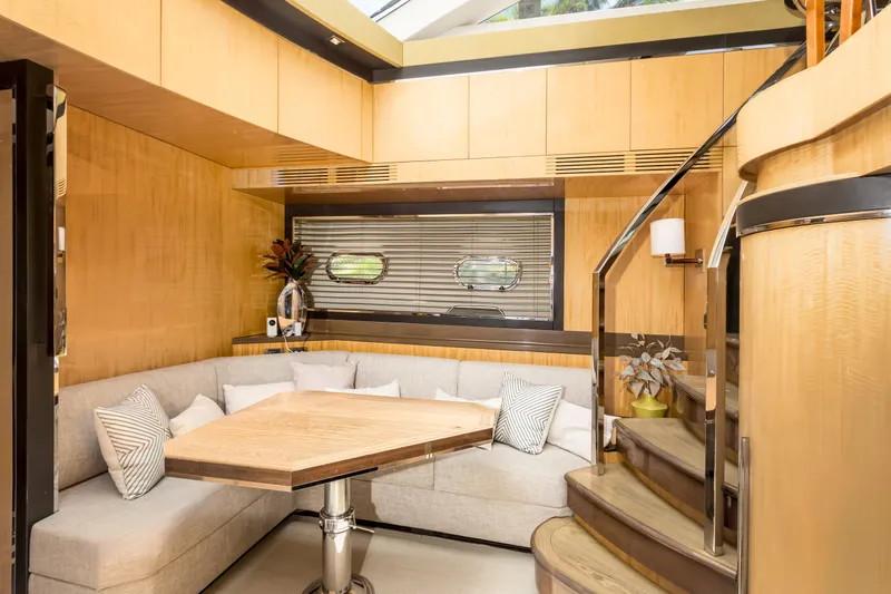 Bikinis Optional Yacht Photos Pics Luxurious interior of 2012 Cheoy Lee 76 Alpha yacht with elegant seating and wooden accents.