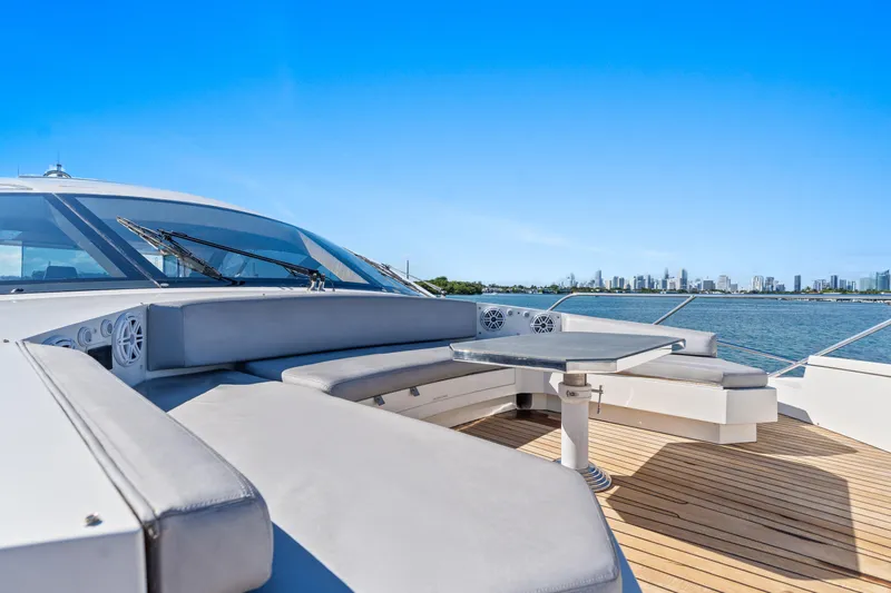 Bikinis Optional Yacht Photos Pics Luxurious 2012 Cheoy Lee 76 Alpha yacht deck with seating, overlooking city skyline and water.