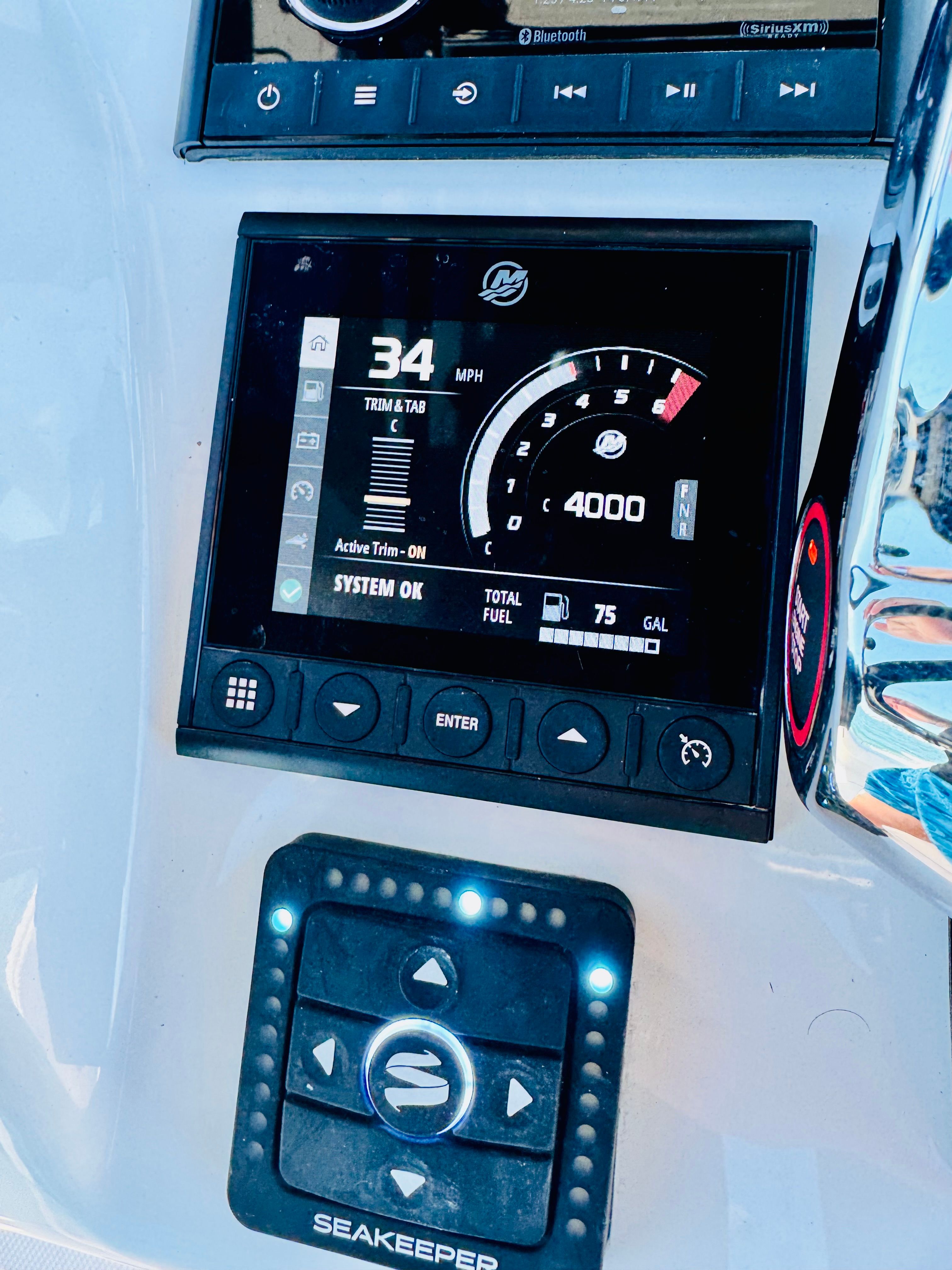 Reef Runner 230 C Open 2026 boat display showing speed and fuel levels.