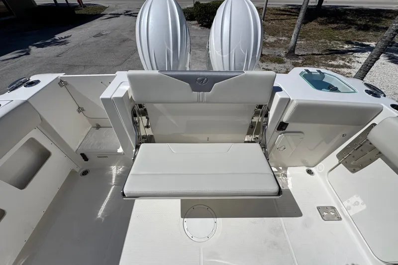  Yacht Photos Pics 2026 Sailfish 272 CC boat interior with foldable seating and storage compartments.
