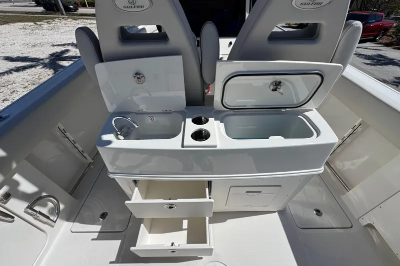  Yacht Photos Pics 2026 Sailfish 272 CC boat interior with sink, storage, and cup holders.