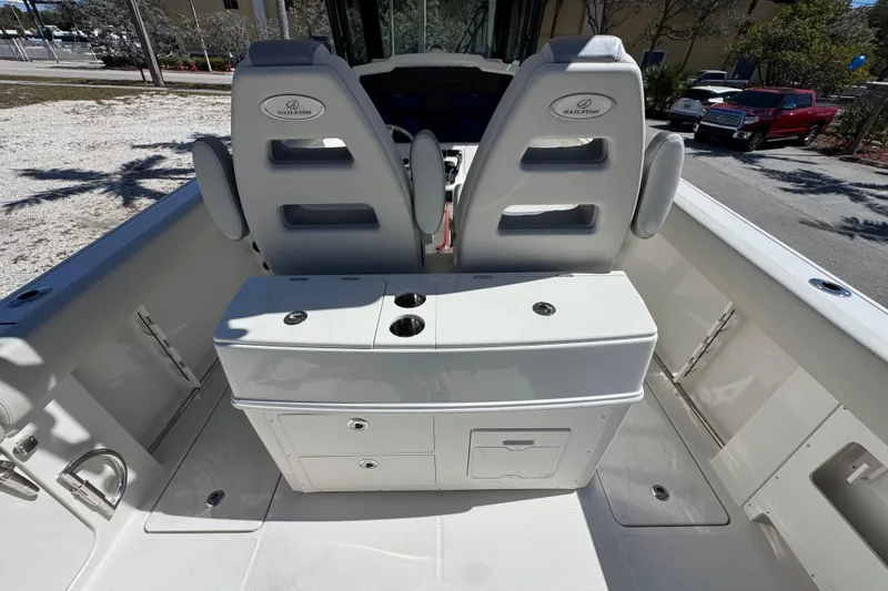  Yacht Photos Pics 2026 Sailfish 272 CC boat interior with dual seats and storage console.