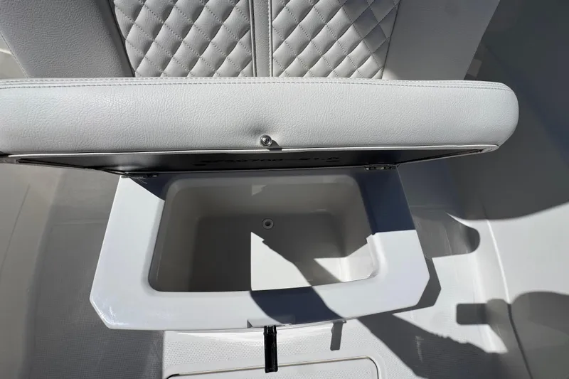  Yacht Photos Pics Open storage compartment on 2026 Sailfish 272 CC boat with quilted seat design.