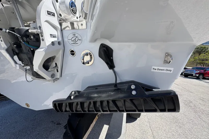  Yacht Photos Pics 2026 Sailfish 272 CC boat stern with warranty label and tie-down instructions.