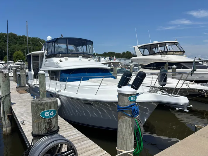  Yacht Photos Pics 1993 Carver 440 Aft Cabin Motor Yacht docked at marina, sunny day.