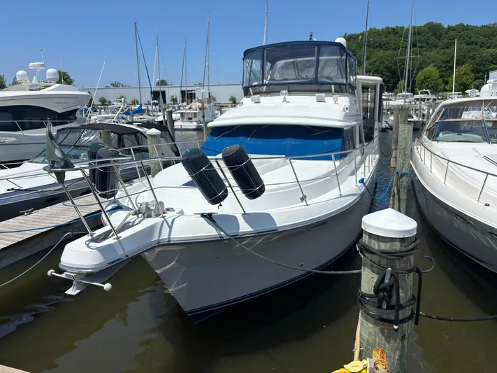 Yacht Photos Pics 1993 Carver 440 Aft Cabin Motor Yacht docked at marina.
