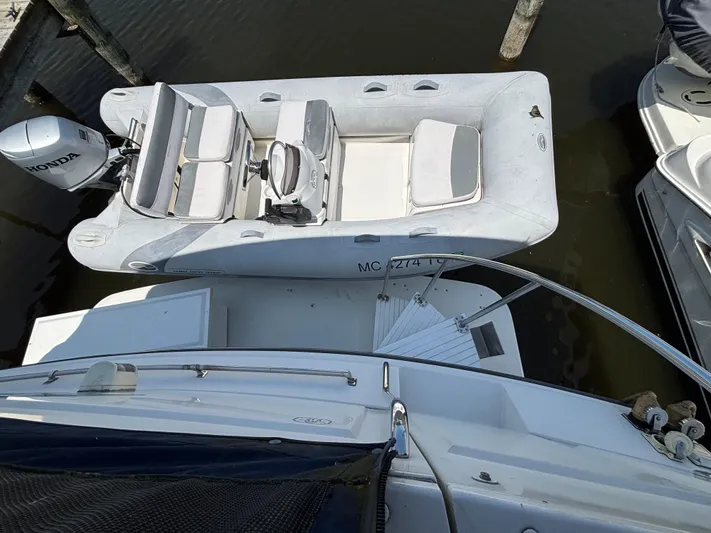  Yacht Photos Pics 1993 Carver 440 Aft Cabin Motor Yacht with inflatable dinghy and Honda outboard motor.