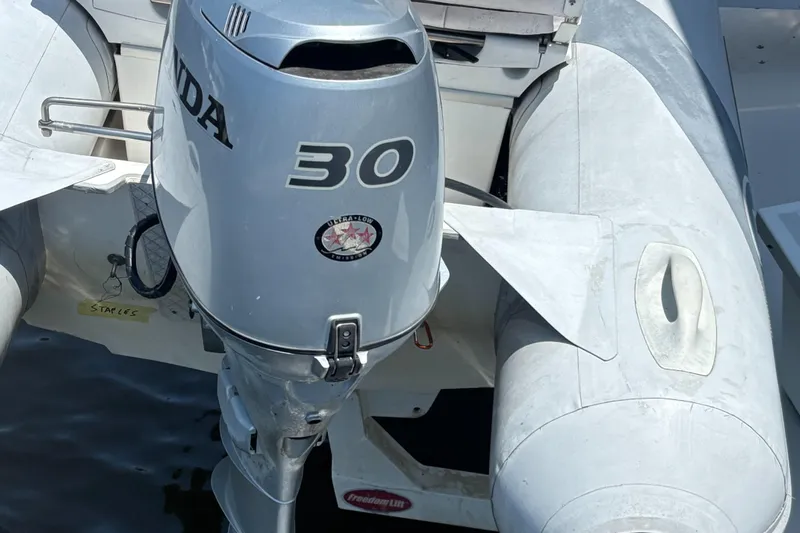  Yacht Photos Pics Outboard motor on inflatable boat, Carver 440 Aft Cabin Motor Yacht, 1993 model.