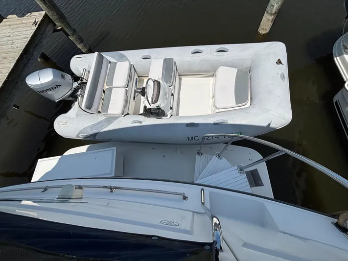  Yacht Photos Pics 1993 Carver 440 Aft Cabin Motor Yacht with inflatable dinghy and Honda outboard motor.