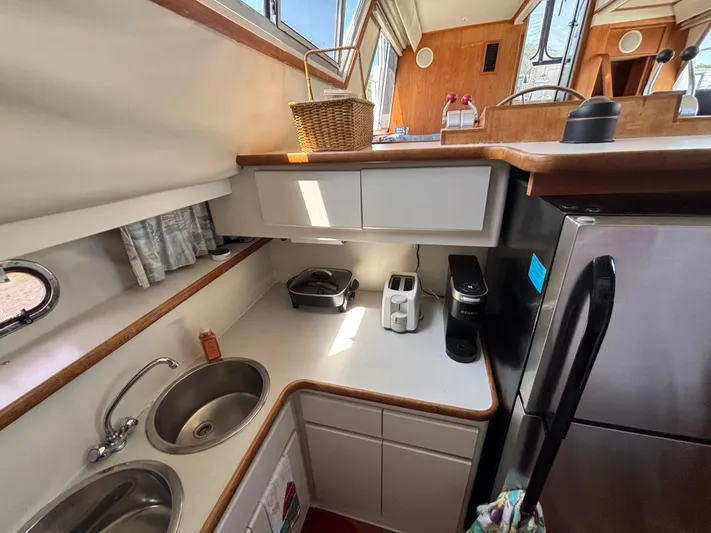  Yacht Photos Pics Compact kitchen in a 1993 Carver 440 Aft Cabin Motor Yacht with modern appliances.