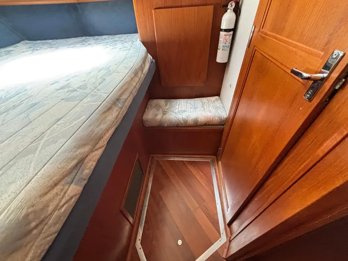  Yacht Photos Pics Interior of 1993 Carver 440 Aft Cabin Motor Yacht with wooden flooring and seating.
