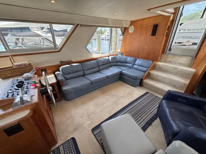  Yacht Photos Pics Luxurious interior of 1993 Carver 440 Aft Cabin Motor Yacht with blue leather seating.