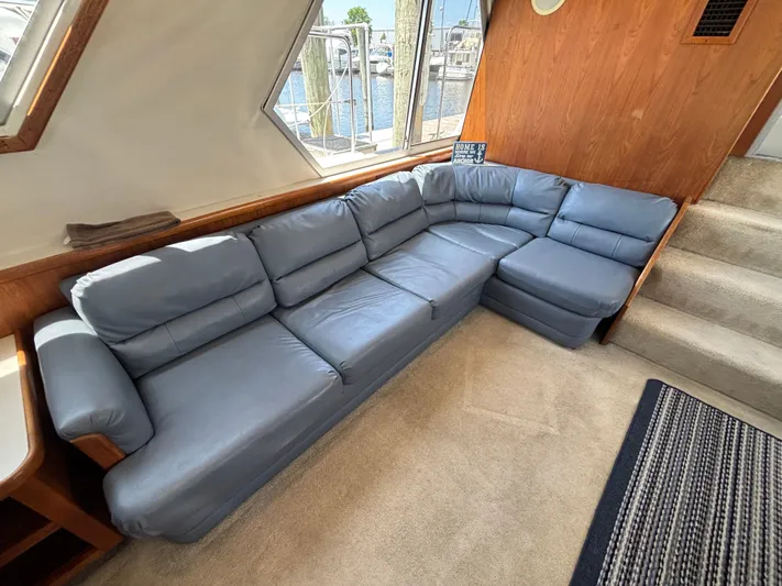  Yacht Photos Pics Interior of 1993 Carver 440 Aft Cabin Motor Yacht with blue sectional sofa.