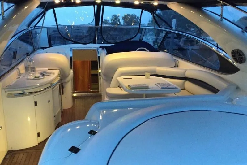  Yacht Photos Pics Luxurious interior of a 1998 Sunseeker Predator 58 yacht with elegant seating and table.