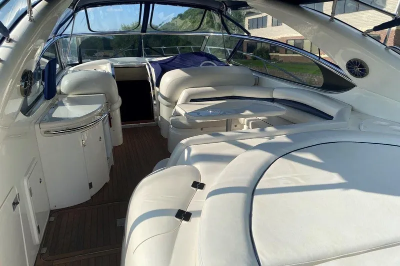  Yacht Photos Pics Luxurious interior of 1998 Sunseeker Predator 58 yacht with white leather seating.