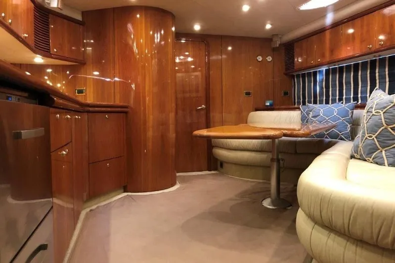  Yacht Photos Pics Luxurious interior of a 1998 Sunseeker Predator 58 yacht with elegant wood finishes.