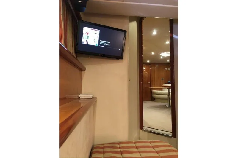  Yacht Photos Pics Interior of 1998 Sunseeker Predator 58 yacht with TV and luxurious seating area.