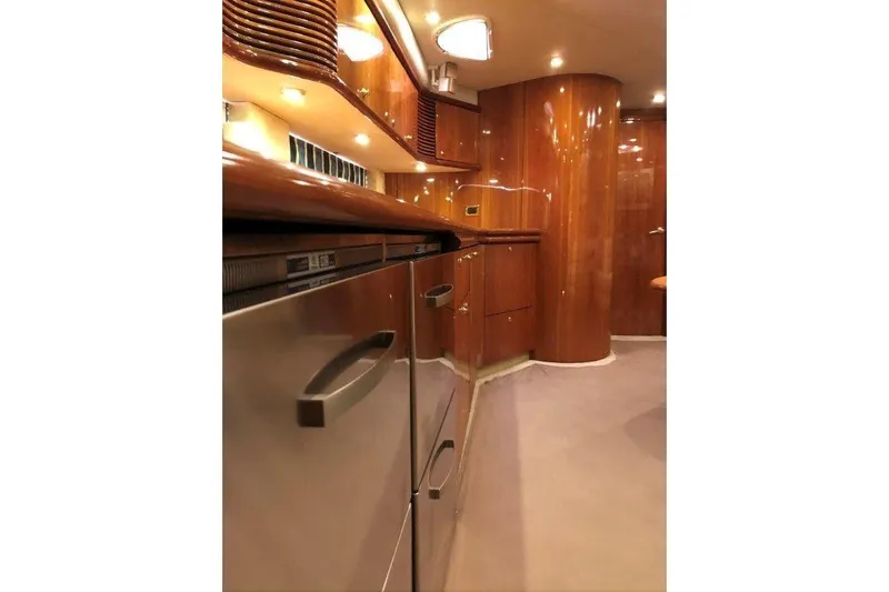  Yacht Photos Pics Luxurious interior of 1998 Sunseeker Predator 58 yacht with polished wood finishes.