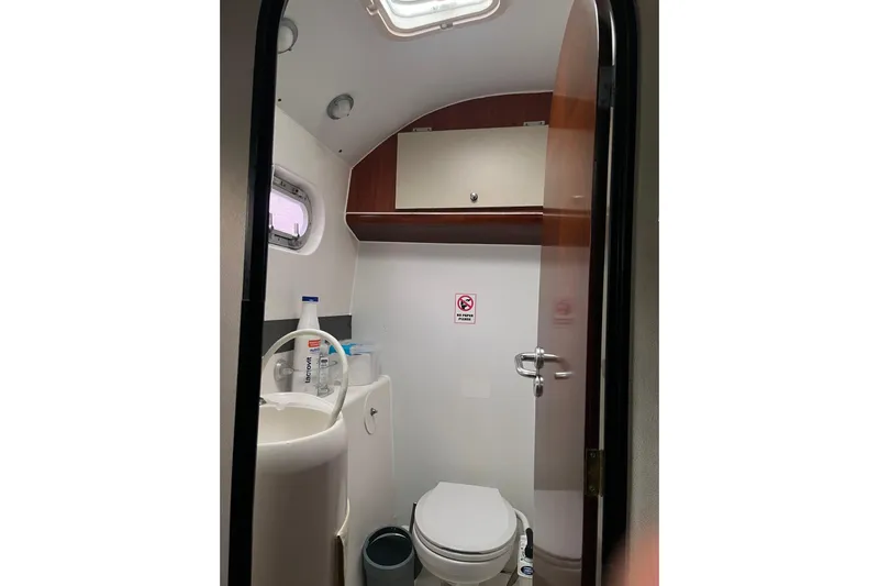 Nikita 1 Yacht Photos Pics Bathroom interior of 2004 Fountaine Pajot Bahia 46 catamaran, featuring compact design and amenities.