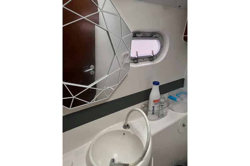 Nikita 1 Yacht Photos Pics Bathroom interior of 2004 Fountaine Pajot Bahia 46 catamaran with mirror and sink.