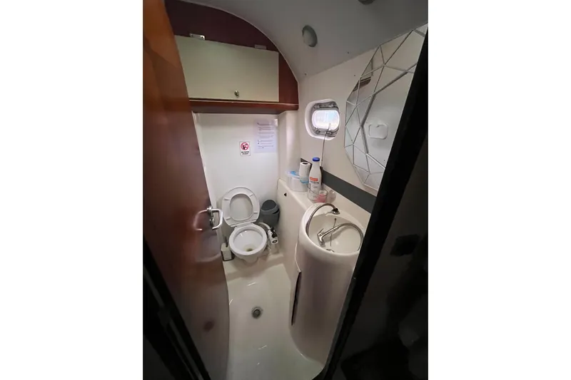 Nikita 1 Yacht Photos Pics Bathroom interior of 2004 Fountaine Pajot Bahia 46 catamaran, featuring toilet and sink.