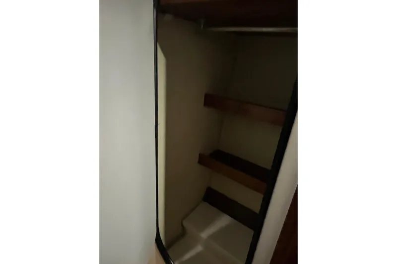 Nikita 1 Yacht Photos Pics Interior storage space with shelves on a 2004 Fountaine Pajot Bahia 46 catamaran.