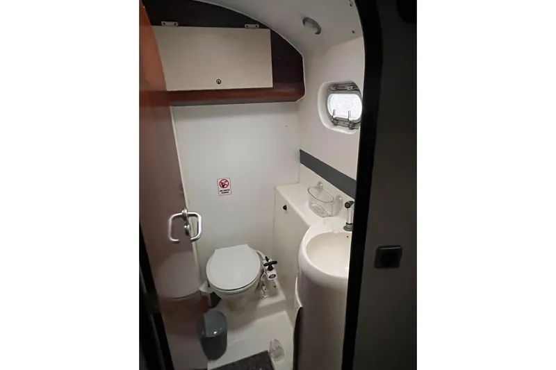 Nikita 1 Yacht Photos Pics Bathroom interior of 2004 Fountaine Pajot Bahia 46 catamaran, featuring toilet and sink.