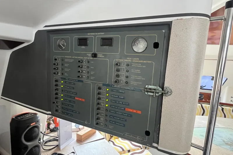 Nikita 1 Yacht Photos Pics Control panel of a 2004 Fountaine Pajot Bahia 46 catamaran, featuring various switches and gauges.