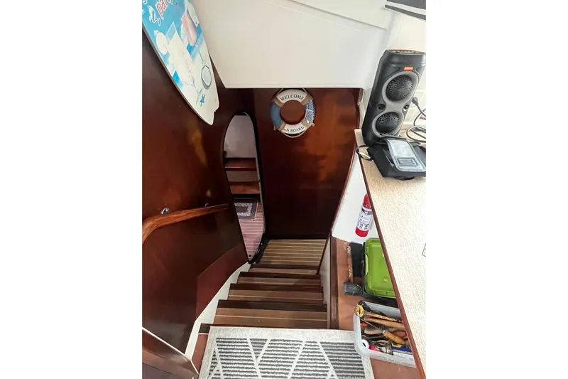 Nikita 1 Yacht Photos Pics Interior view of 2004 Fountaine Pajot Bahia 46 yacht staircase with nautical decor.