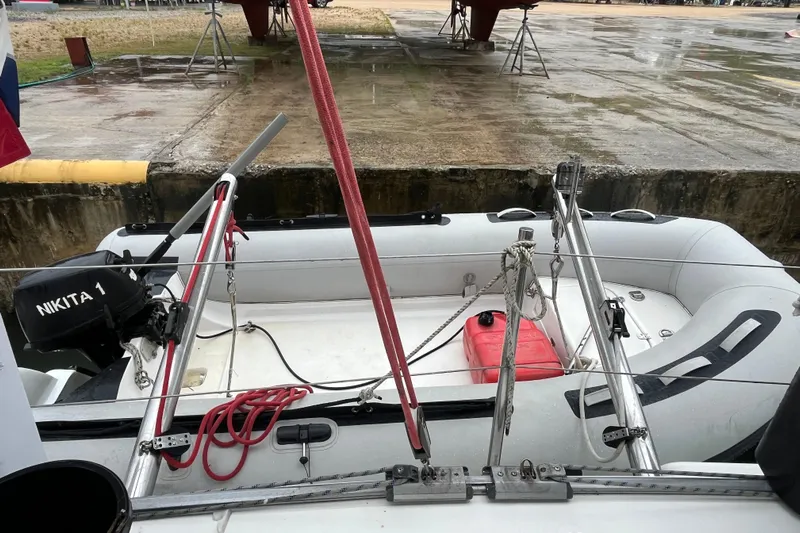 Nikita 1 Yacht Photos Pics Inflatable boat with motor, docked near a Fountaine Pajot Bahia 46, 2004 model.