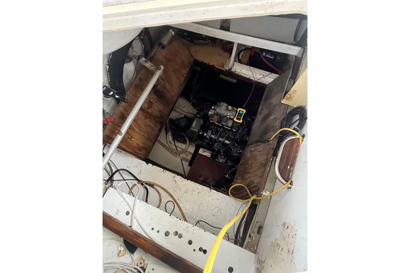 Nikita 1 Yacht Photos Pics Engine compartment of 2004 Fountaine Pajot Bahia 46 catamaran, showing mechanical components and wiring.