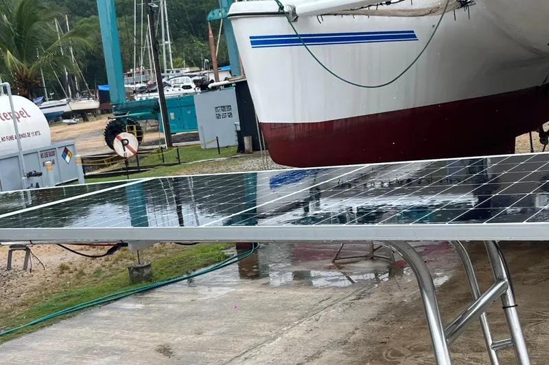 Nikita 1 Yacht Photos Pics 2004 Fountaine Pajot Bahia 46 catamaran with solar panels in a boatyard setting.