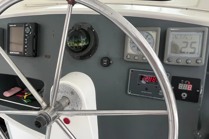 Nikita 1 Yacht Photos Pics Steering wheel and navigation instruments on 2004 Fountaine Pajot Bahia 46 catamaran.