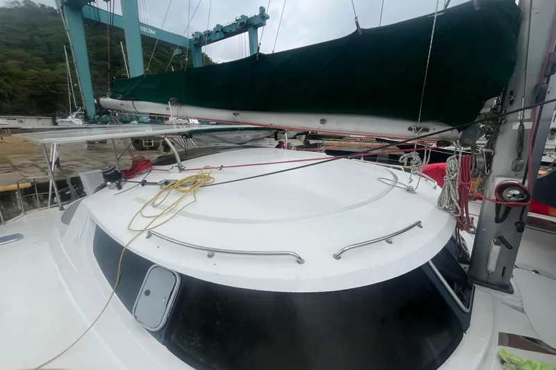 Nikita 1 Yacht Photos Pics 2004 Fountaine Pajot Bahia 46 catamaran with green sail cover at dock.