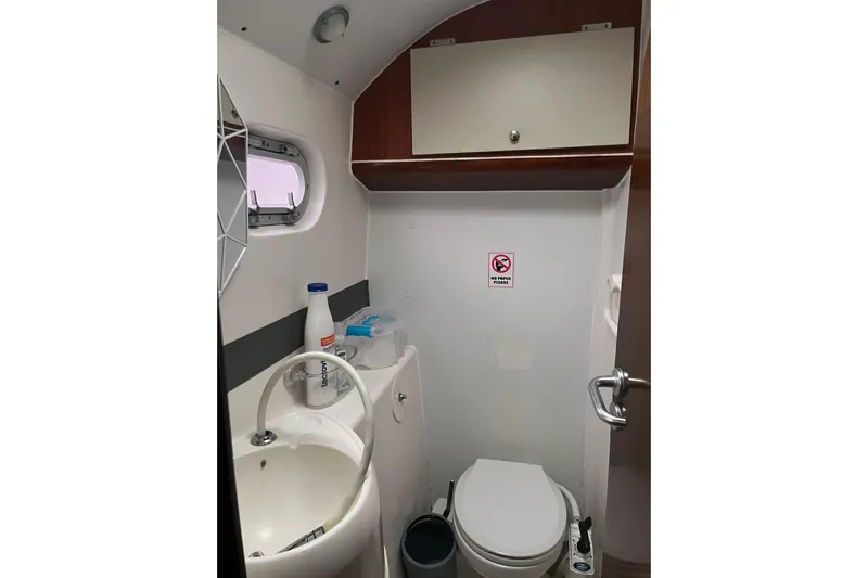 Nikita 1 Yacht Photos Pics Bathroom interior of 2004 Fountaine Pajot Bahia 46 catamaran, featuring sink and toilet.