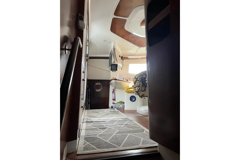 Nikita 1 Yacht Photos Pics Interior view of 2004 Fountaine Pajot Bahia 46 catamaran, featuring cozy cabin and modern design.