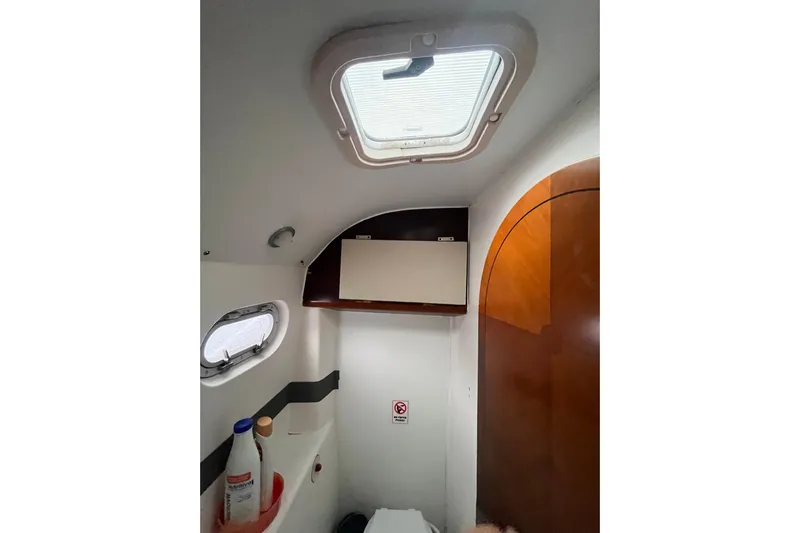 Nikita 1 Yacht Photos Pics Interior of 2004 Fountaine Pajot Bahia 46 yacht bathroom with skylight and storage.