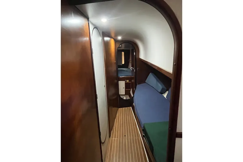 Nikita 1 Yacht Photos Pics Interior of 2004 Fountaine Pajot Bahia 46 catamaran, featuring a cozy cabin with wooden finishes.